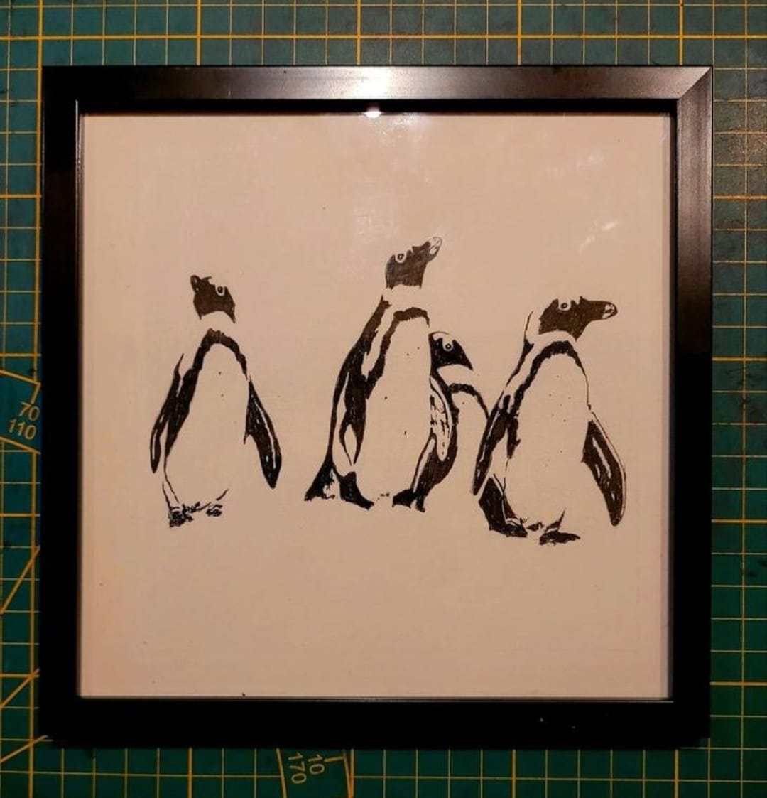 Pentekening pinguïns ingelijst